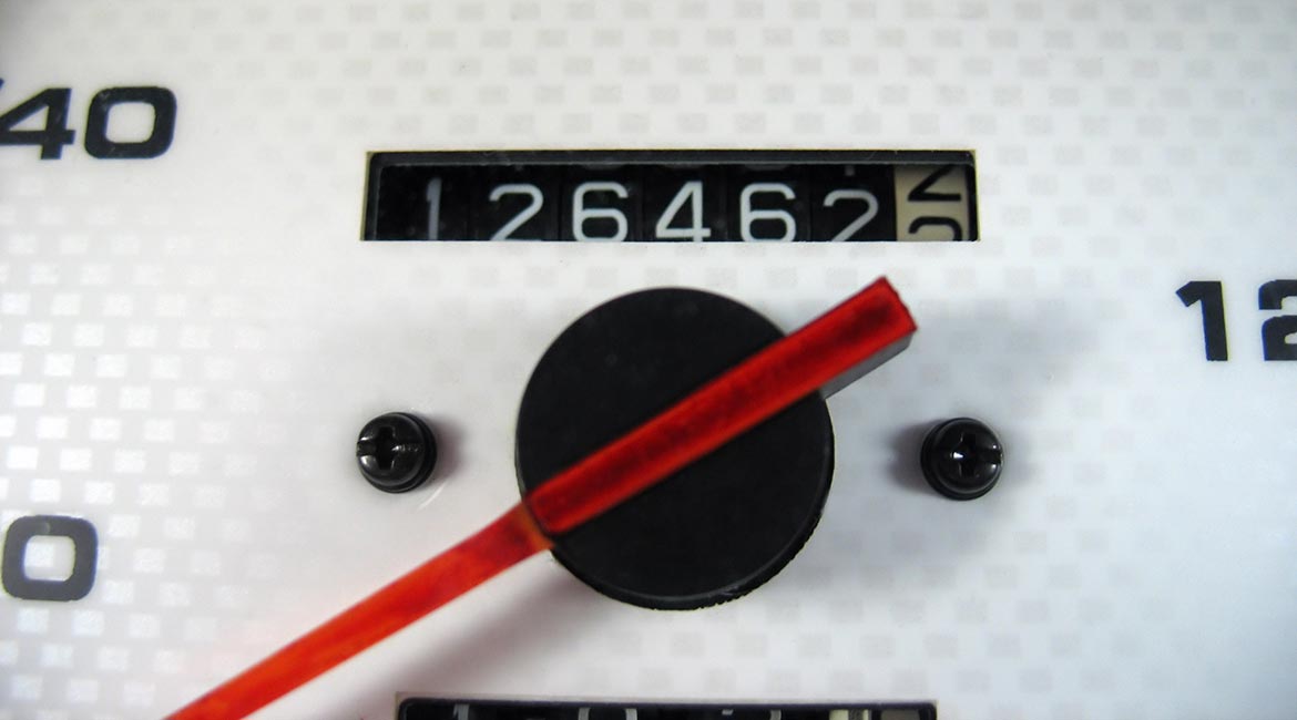 Close up of odometer, representing mileage tracking